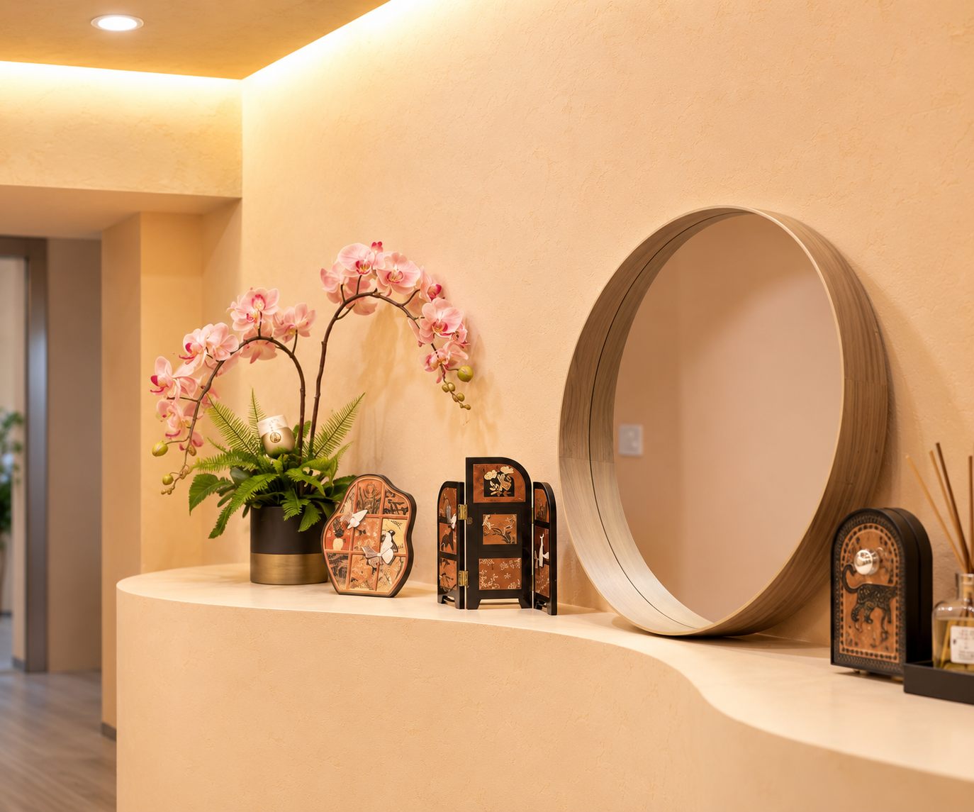 Tang Beauty interior detail with an orchid arrangement and round mirror